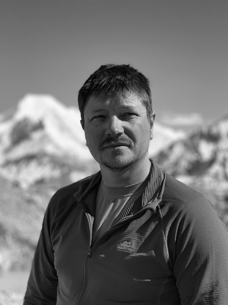Image shows black and white photo of Gordon in mountaineering clothing.